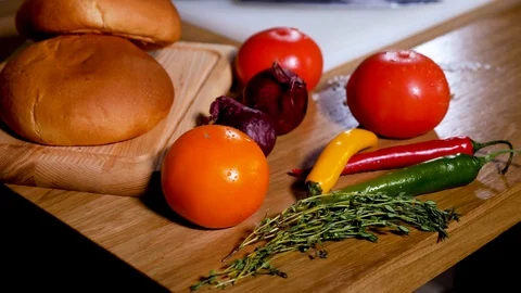 Wooden Table with vegetables and bread Stock Footage 94035184