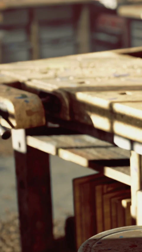 Wooden table in a workshop where carpentry work takes place during daytime Stock Footage 334186188