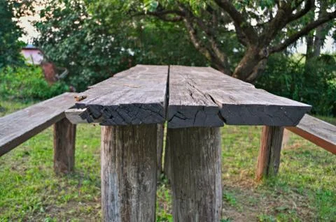 Wooden table in yard, close up Stock Photos