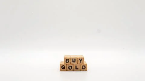 Wooden Text Block of "BUY GOLD" on Isolated Background Stock Photos