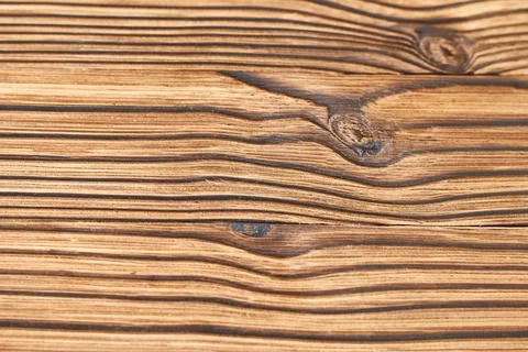 Wooden texture with natural patterns as a background, close-up Stock Photos