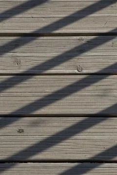 Wooden texture of a pavement between light and shadow Stock Photos