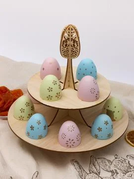 Wooden tiered egg holder with painted eggs variant Stock Photos