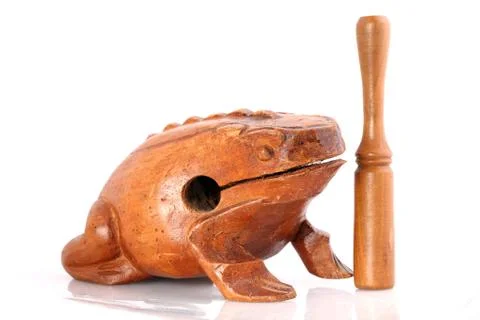 Wooden toad rhythm percusion instrument on white background Stock Photos