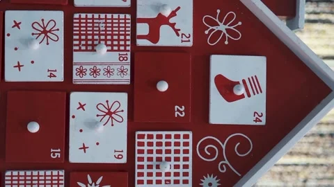Wooden Tree Advent Calendar in Front of a Real Christmas Tree Decorated Stock Footage 321867003