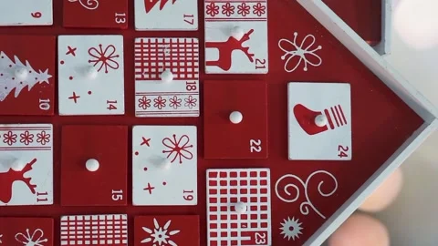 Wooden Tree Advent Calendar in Front of a Real Christmas Tree Decorated Stock Footage 321867025