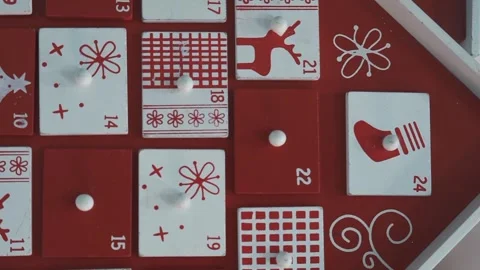 Wooden Tree Advent Calendar in Front of a Real Christmas Tree Decorated Stock Footage 321867232