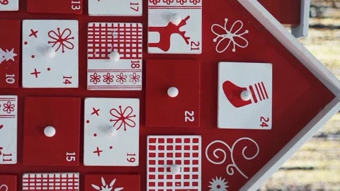 Wooden Tree Advent Calendar in Front of a Real Christmas Tree Decorated Stock Footage 321867239