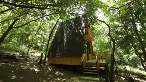 Wooden triangular house in the forest 1 库存影片 331170195