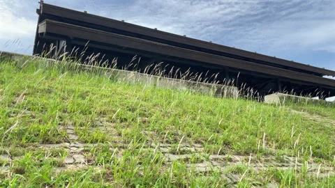Wooden Viewing Platform Above A Grassy Embankment Under Summer Sky Stock Footage 344230251