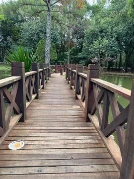Wooden walkway in the park Stock Photos