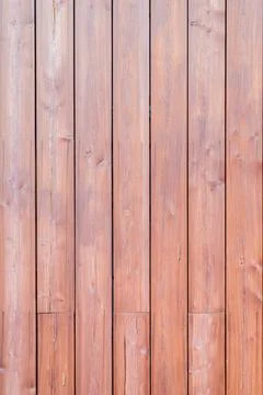 Wooden wall made of solid brown planks of wood, vertical fence. Texture bac.. Stock Photos
