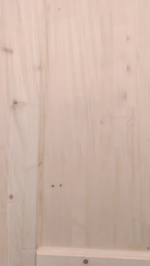 Wooden wall panels being adjusted and positioned in a workshop setting for Stock Footage 342819729