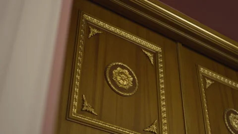 Wooden walls decorated with rectangular golden frames Stock Footage 316097010