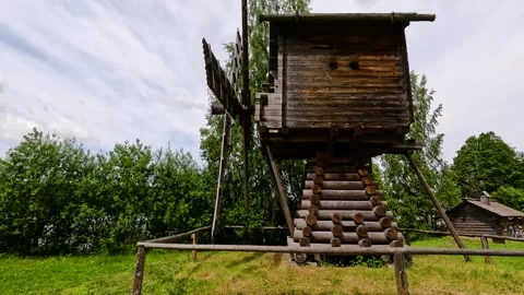 Wooden windmill by a lake. Video stock 342387762