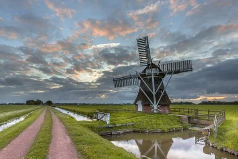 Wooden windmill road Stock Photos