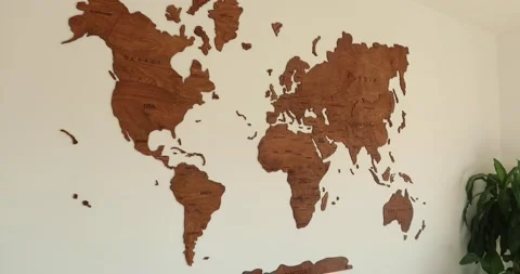 Wooden world map modern interior design on white wall with usa zoom in 4k Stock Footage 230493345