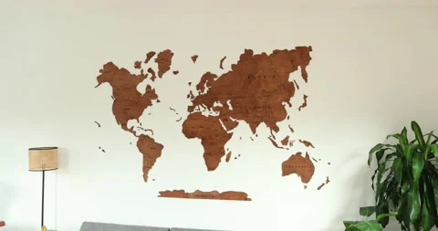 Wooden World Map in modern simplistic room with elegant interior design pan. 4k Stock Footage 230492235