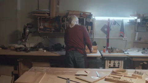 Woodmaker Looking through Toolbox Stock Footage 253382683