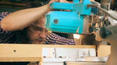 Woodman is using a circular saw in slow motion Stock Footage 113514772
