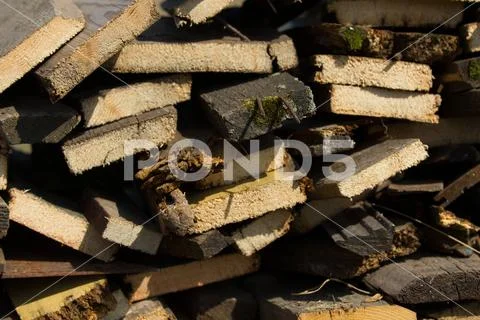 Woodpile - firewood for the winter, design or texture - telephoto shot Stock Photos