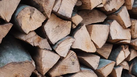 Woodpile of a split tree in close-up. Logs of firewood, chopped and stacked Stock Footage 195846115