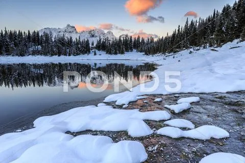 Woods And Snowy Peaks Are Reflected In Lake Palu At Sunrise, Malenco Valley,