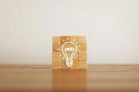 Woods block square with virtual lightbulb. New ideas inspiration and innova.. Stock Photos