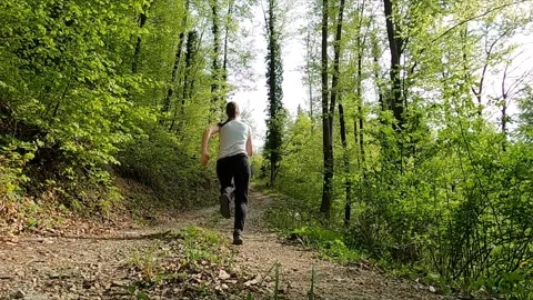 Into the Woods: Running into the Unknown Stock Footage 317648891