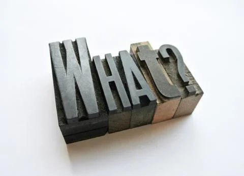 Woodtype letters asking a question what Stock Photos