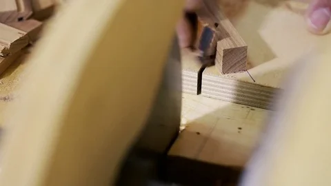Woodwork - carpenter working with plane and wood plank at workshop Stock Footage 81485726