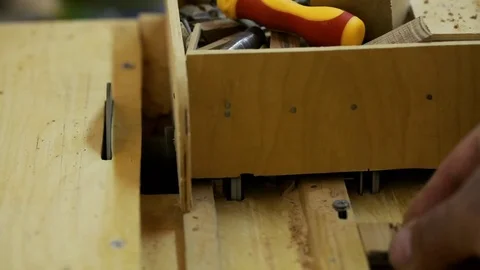 Woodwork - carpenter working with plane and wood plank at workshop Stock Footage 81485750