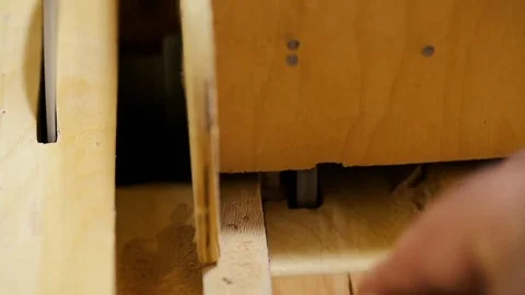 Woodwork - carpenter working with plane and wood plank at workshop Stock Footage 81485764