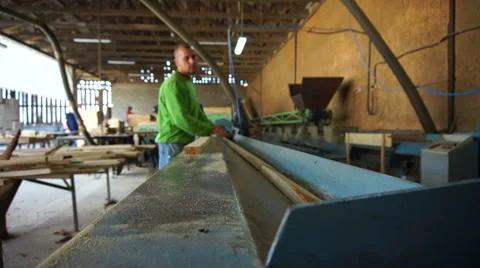 Woodwork industry worker marks planks for cutting slow motion Stock Footage 46913858