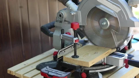 Woodwork on a miter saw Stock Footage 201239741