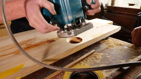 Woodwork routing chamfer timber older gentleman and lady assistant Vidéo 231891630