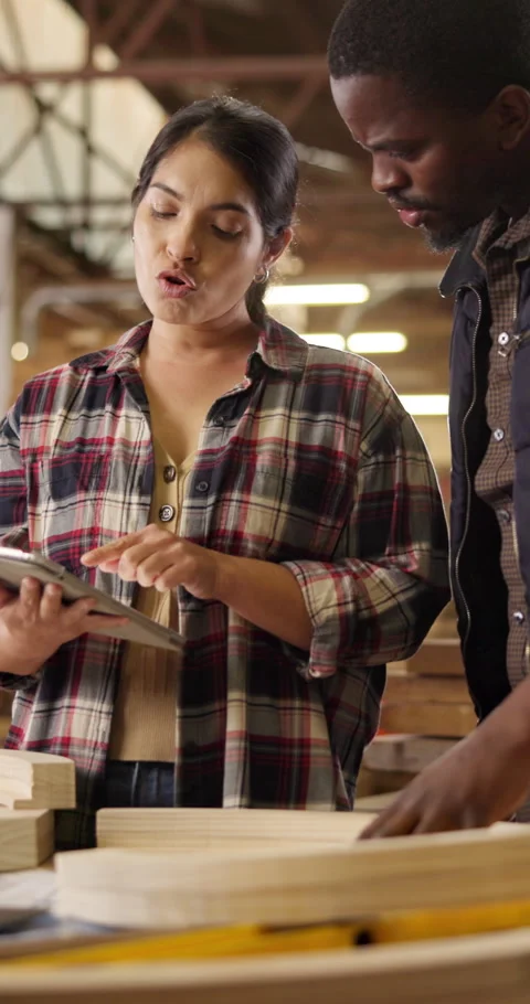 Woodwork, tablet and team talk in workshop for timber quality assessment, design Stock Footage 340985263