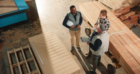 Woodwork, team and planning with tablet in warehouse, timber inventory or Stock Footage 341309680