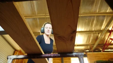 Woodwork thicknessing timber being stacked underneath view Vidéo 231787944