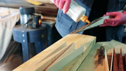 Woodworker Applying Glue to Boards Stock Footage 75951877