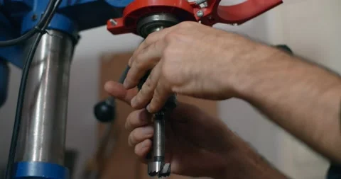 Woodworker change drill in the drilling machine in slow motion, carpentry at Stock Footage 168498013