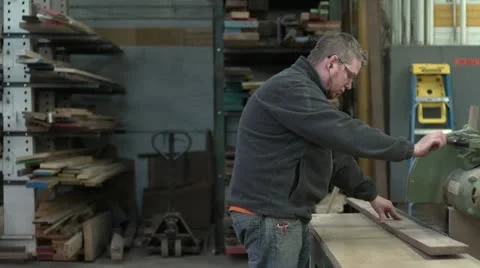Woodworker cutting a board, slow motion Stock Footage 11016546