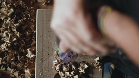 Woodworker drills a walnut board with a milling cutter for wood. woodworking  Stock Footage 144243796