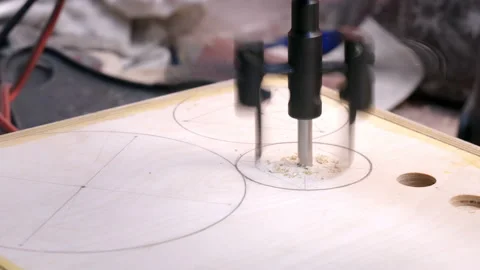 Woodworker drills wooden board with adjustable circle cutter Stock Footage 195112341