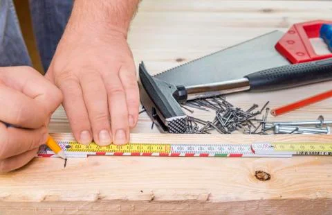 Woodworker hands and carpentry tools Stock Photos