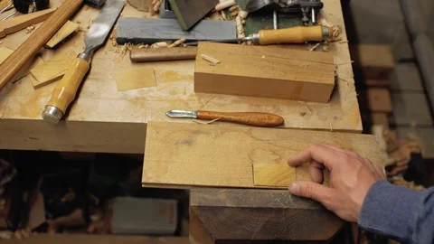 Woodworker inserts wooden beard comb into wooden pattern. handmade. 4k Stock Footage 105637868