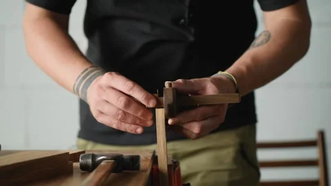 A woodworker makes the markings on the oak blank using marking gauge. handmad Stock Footage 144244562