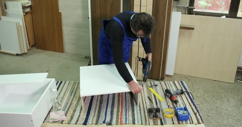 Woodworker Man Work Drill and Screwing in Plywood Using Device Carpentry Concept Stock Footage 85587460