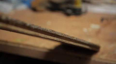 Woodworker measuring thickness of a board Stock Footage 42234242