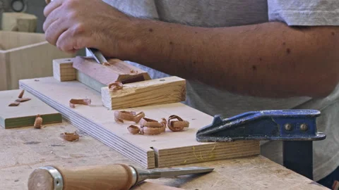 Woodworker planing wood in workshop Stock Footage 337549617